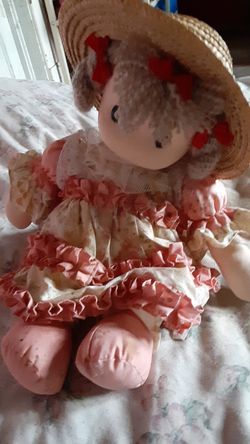 It's a precious moment doll play it a small world after all