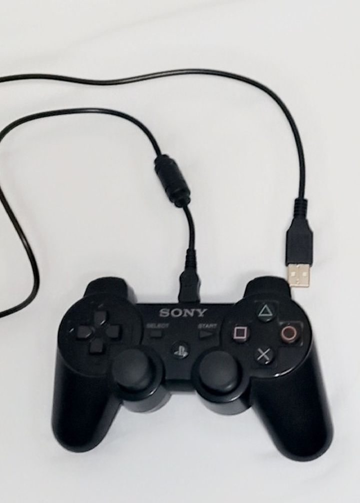 PlayStation Controller With USB Cord Included - In Great Condition And Works Great.