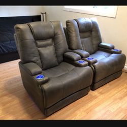 Grey Leather Power Recliners 3 adjustable types of support: head, back and feet. Fully reclinable chairs with USB charger.  Sleek, mod $475 each.  Sof