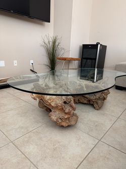 Glass coffee table with driftwood base