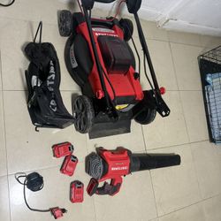 Electric mowers with cordless batteries, specifically the V20 model with a 5.0 Ah capacity, and blowers. 