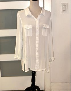 Ralph Lauren white button-down blouse features a sheer design with two chest pockets and long sleeves