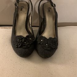 Size 7.5 Grey Heals. Good Condition