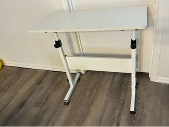 Small rising desk with wheels