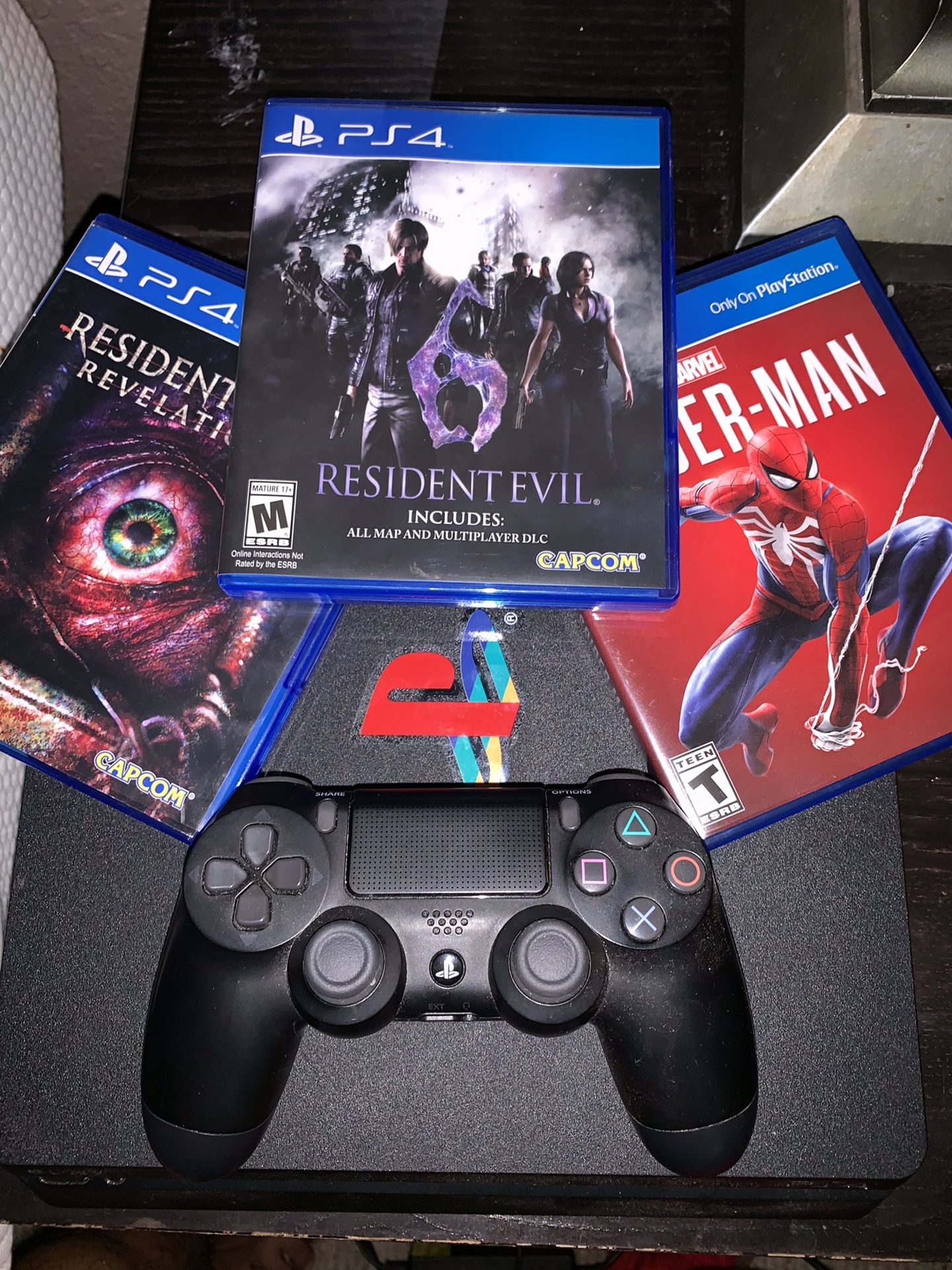 PlayStation 4 with controller and games