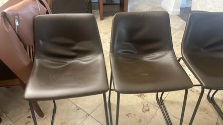 4 brown barstool chairs