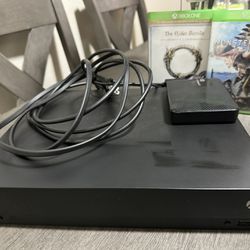 Xbox One X, 1TB Lightly used with External 2TB Hard-drive, and two games!!