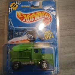 1990 Hot Wheels Oshkosh Snowplow in green with a blue card. 