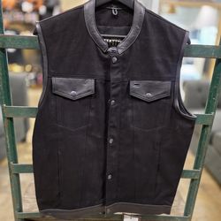 Denim vest with leather trim  $120 FIRM