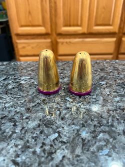 Vintage Thai Gold Tone Pair of Salt and Pepper Shakers.  Size approximately 2 1/2 inches tall.  Made by Bangkok Arts & Crafts stamped on the bottom. P