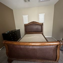 Queen Sleigh Bed Frame -real wood upholstered leather.