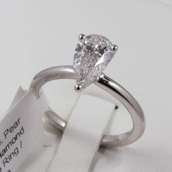 New Pear shaped Diamond Ring, 1.5 carats in 14k white gold band. IGI certified