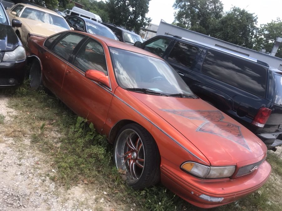 96 impala Ss custom Wheels ,custom music ,tv,tubbed out. in rear. The quarter panel needs to be replaced and have custom Door panels not complete