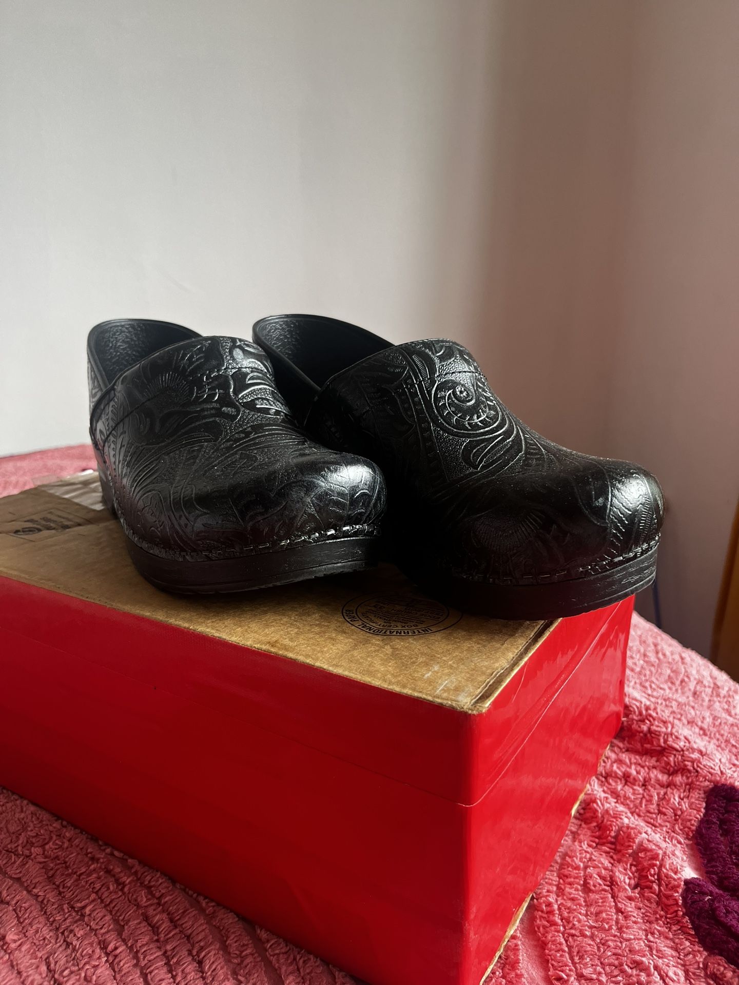 Dansko Black Floral Etched Clogs