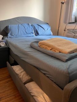 Queen-size bedframe with mattress + pillows