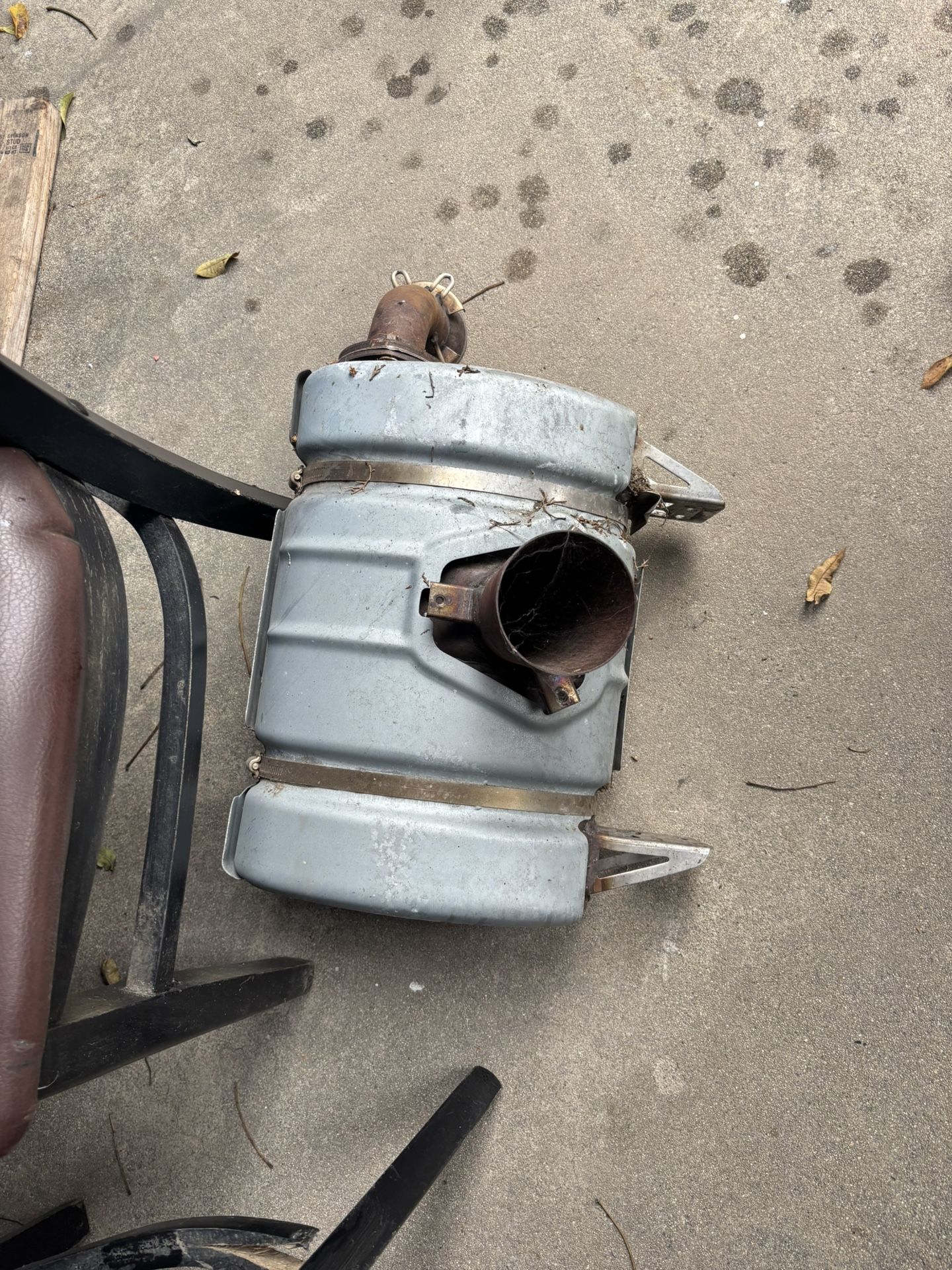 stock exhaust muffler from a Can-Am Maverick X3