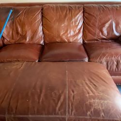 leather couch and ott and 2 chairs and table