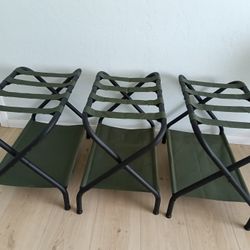 Three Songmics Luggage Racks