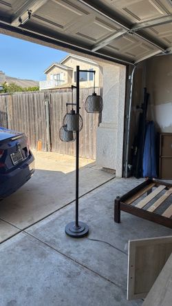 This is a Stylecraft Adona 72" high, 3-light floor lamp