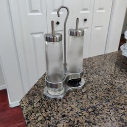 IKEA CITRONHAJ oil and vinegar bottle made of frosted glass and stainless steel.