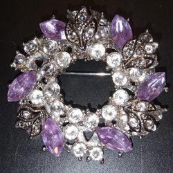 Breathtakingly beautiful silver wreath brooch featuring dozens of crystal rhinestones and six teardrop shaped pink rhinestones