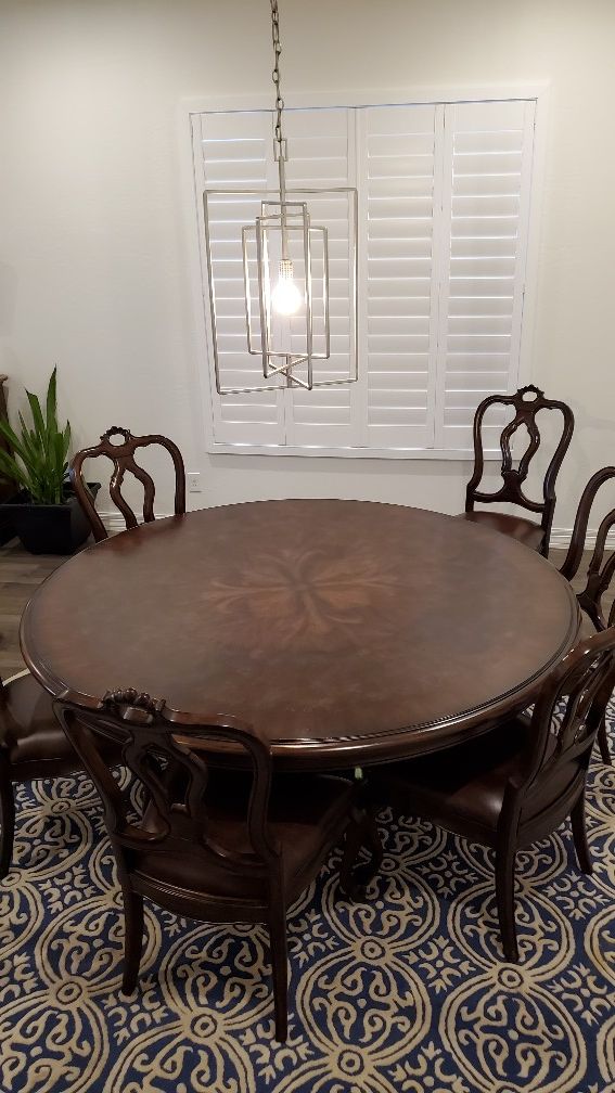 Thomasville 72" round wood table, six wood chairs With Leather Seats.