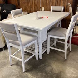 Brand new table, and four stools 999