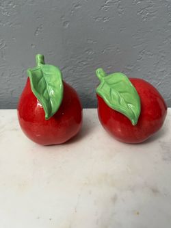 Vintage ceramic Shaped Red pears Pair of Salt and Pepper Shakers. Size approximately 3 1/2 inches tall. Never used has been on display in a cabinet