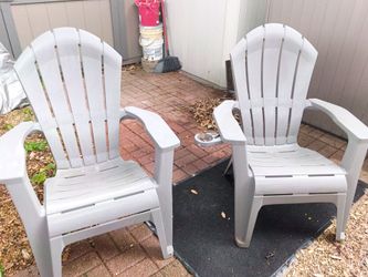 2 plastic patio or lawn chairs with cup holders