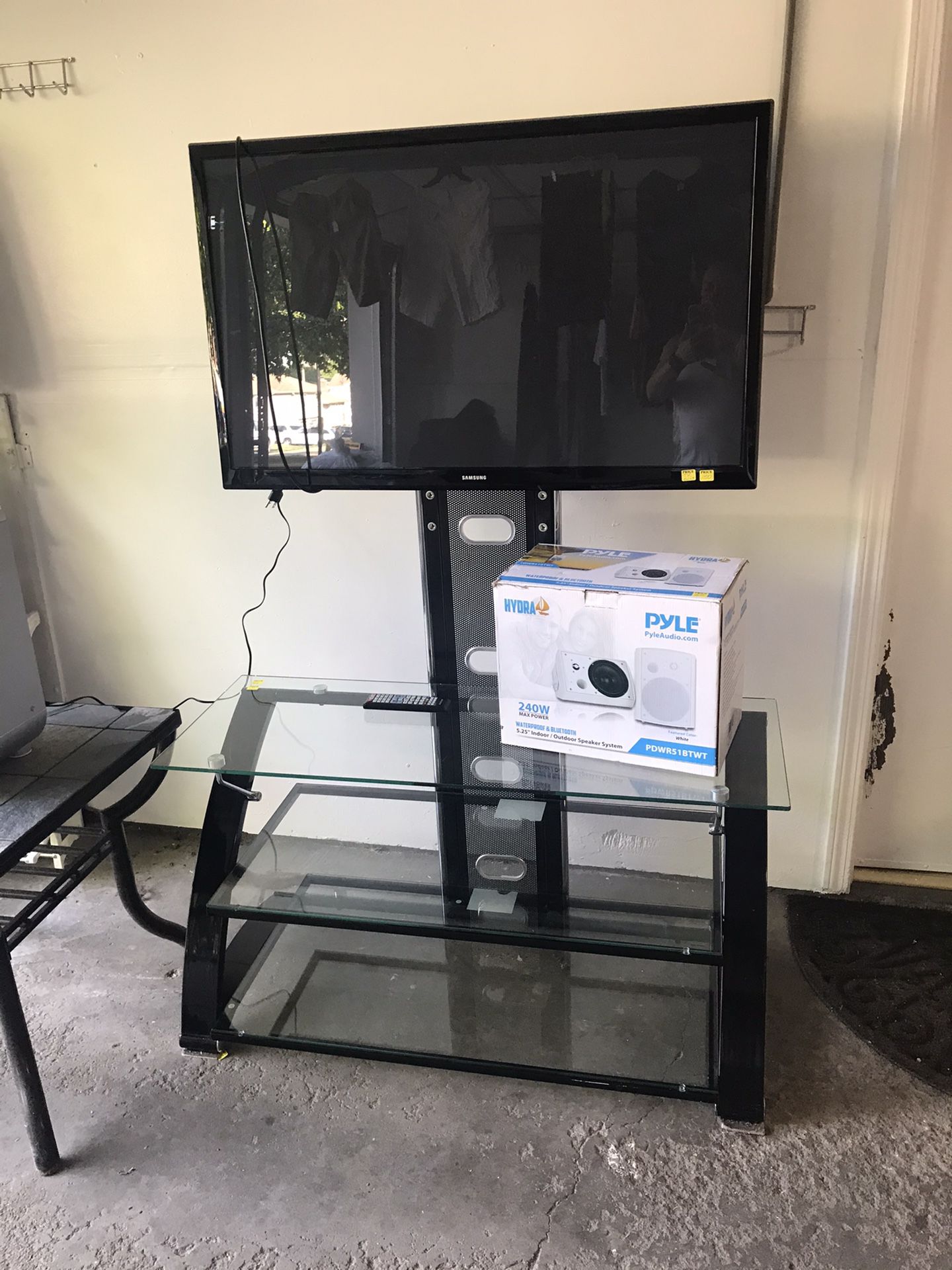 Tv glass stand and Samsung 40”tv.