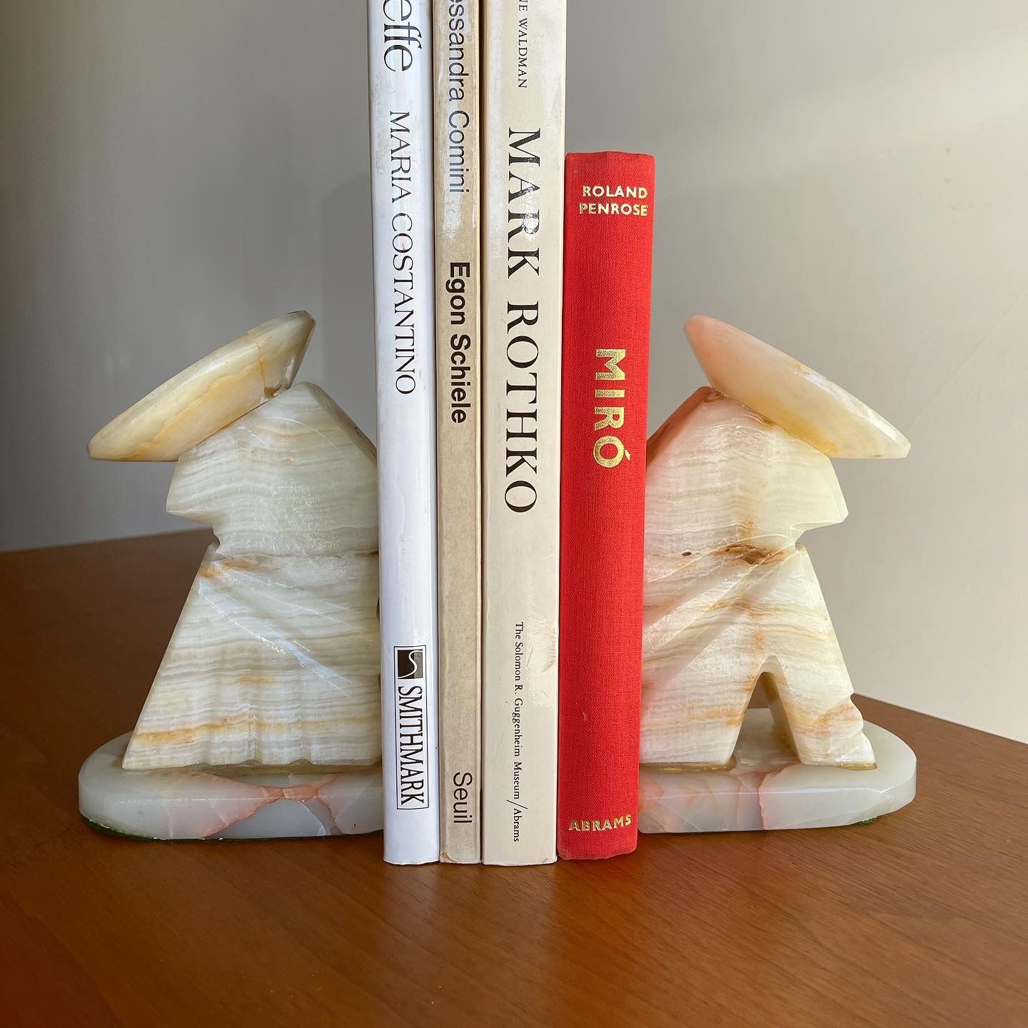 Pair of vintage onyx marble bookends of kneeling man w/ sombrero