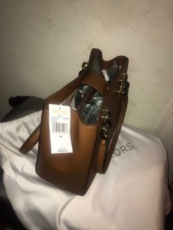 MK brown purse, COACH black purse