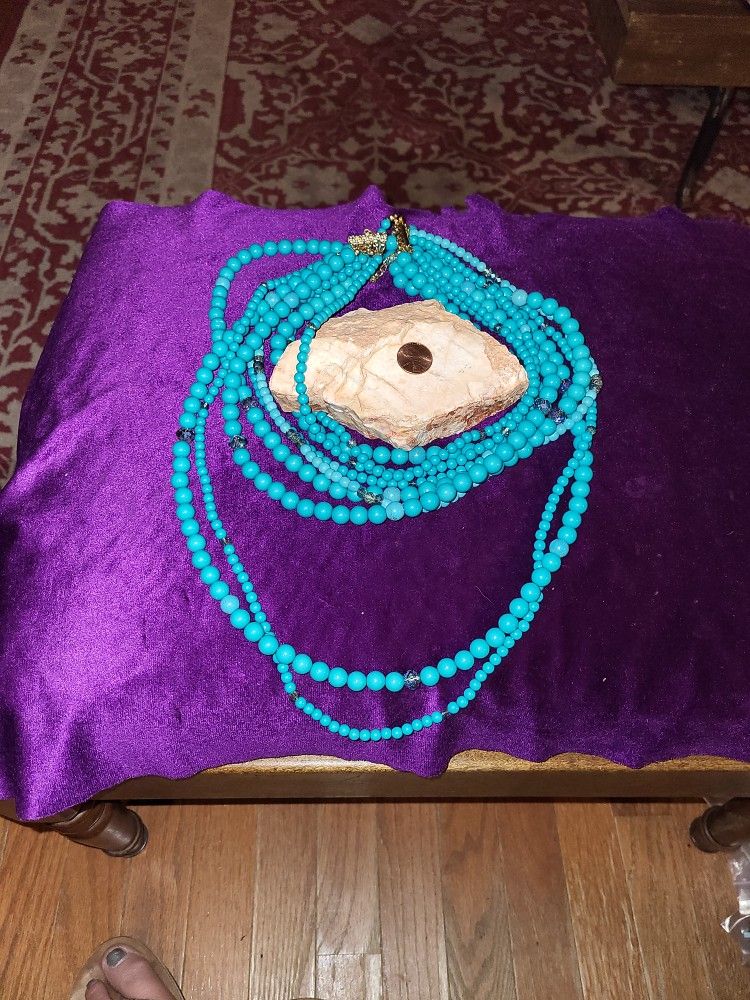 9 Strand Turquoise Colored Necklace