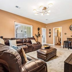 Brown Leather and Ottoman