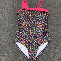 Emoji brand girls 7/8 one piece swimsuit featuring a ruffle trim.     