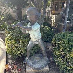 Bronze baseball boy statue