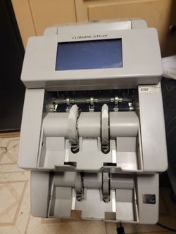 Cummins Allison JetScan Model 4096, which is a professional, high-performance two-pocket currency scanner and money counter.