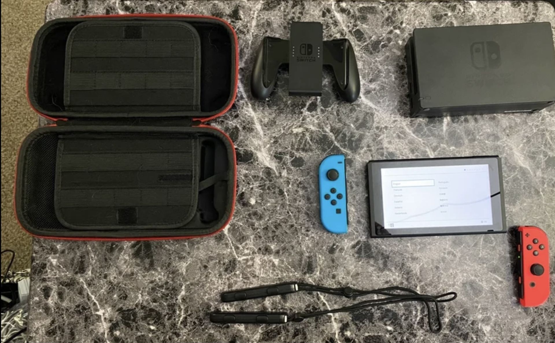Nintendo Switch Console, Remotes, Docking Station And Carrying Case