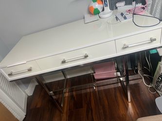 White dresser with mirror, matching desk, and nightstand