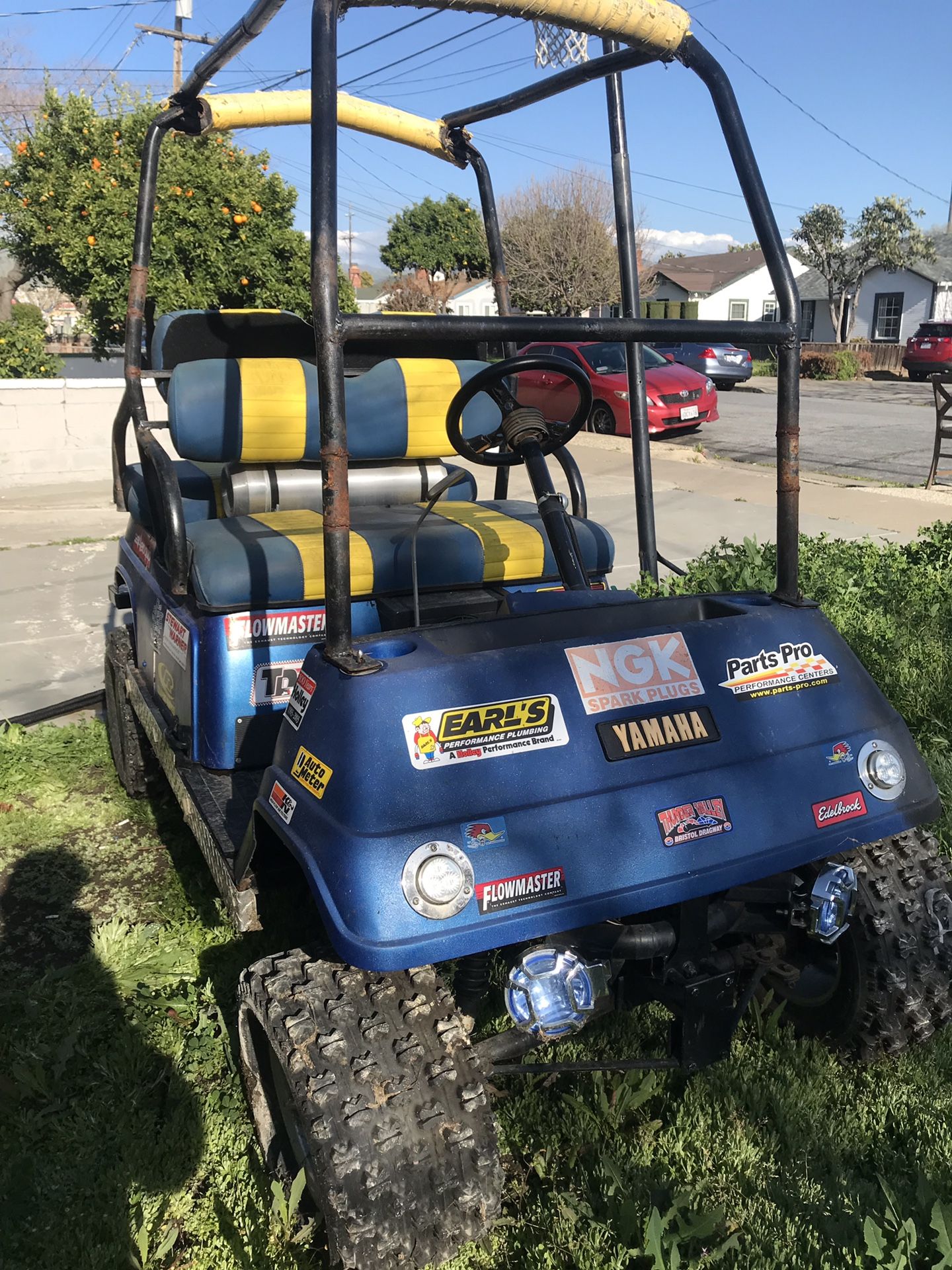 Stretched and lifted golf cart on steroids full roll bar and 4 seater