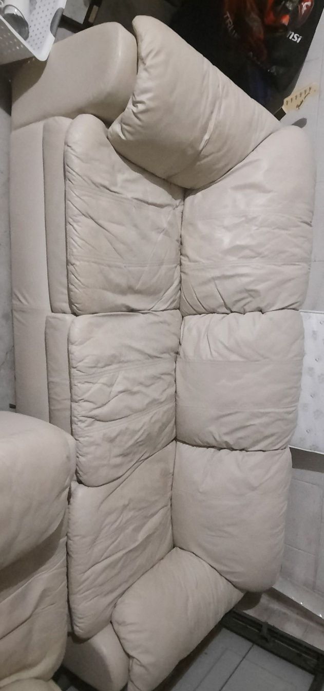 Worn white leather couch
