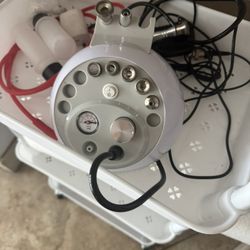 Mini traveling, micro dermabrasion machine with filters and seven heads excellent for a traveling aesthetician