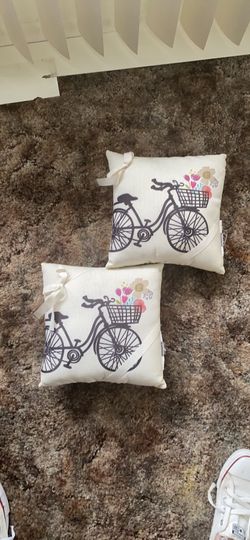 2 small new pillows with bike and yellow back