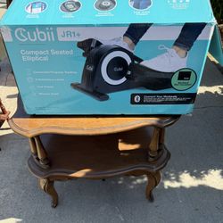 Compact seated elliptical 
