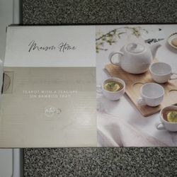 Tea Pot With 4 Tea Cups On A Bamboo Platter