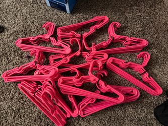 Lot of pink kids hangers