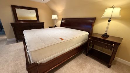 mattress, bed frame, two nightstands, one storage cabinet, mirror, two table lamps