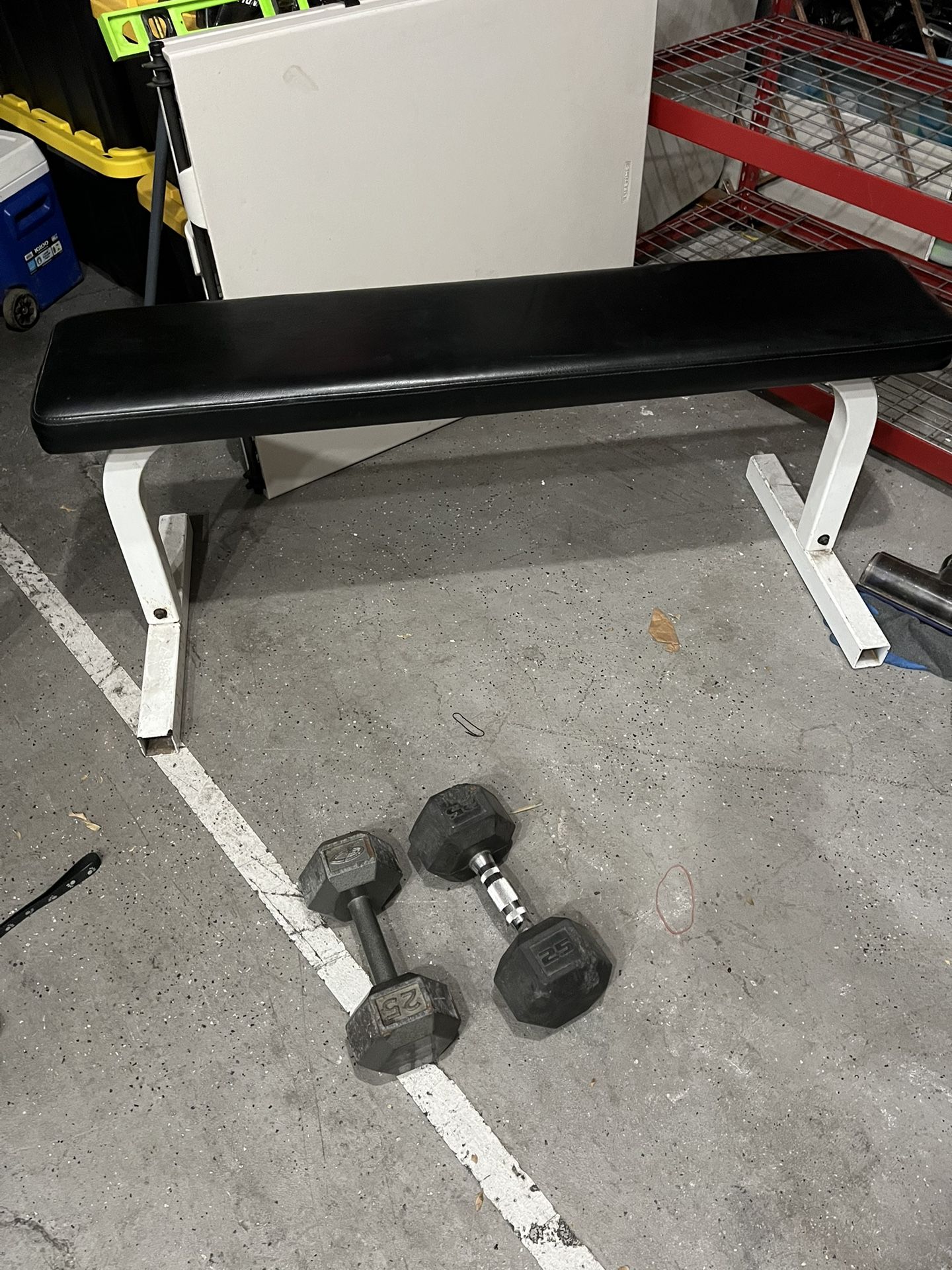 Flat weight bench with dumbbells