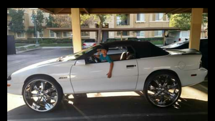 Camaro Z28 on 26-inch rims rag top