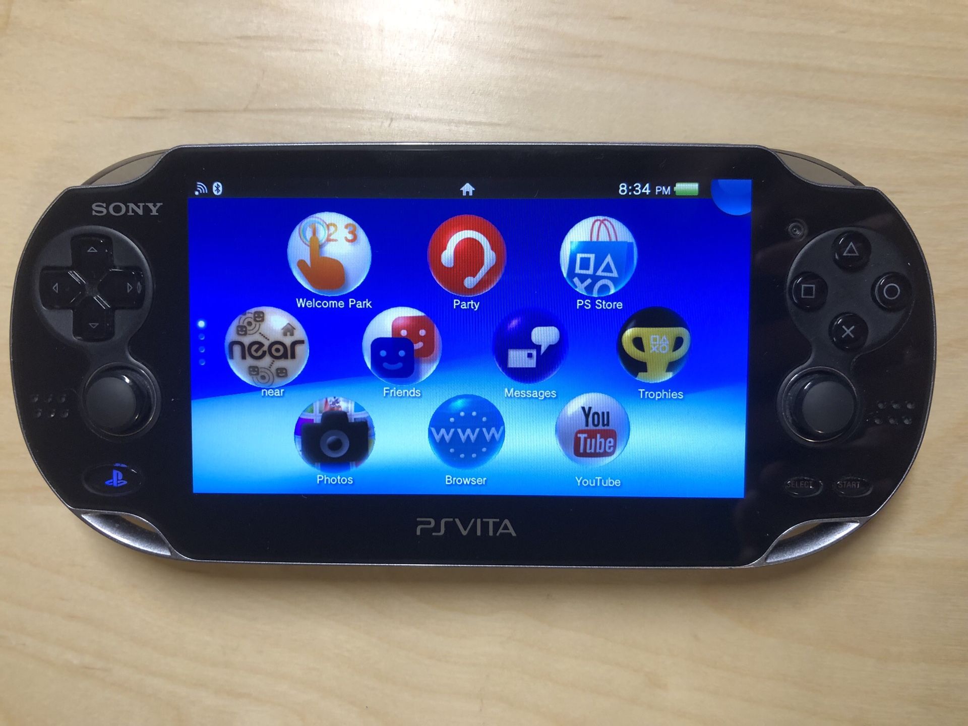 PlayStation Vita (1st gen WiFi and OLED model) with memory cards